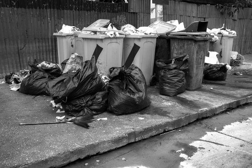 Construction site with builders managing waste